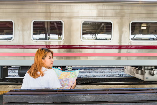 woman with map at train station