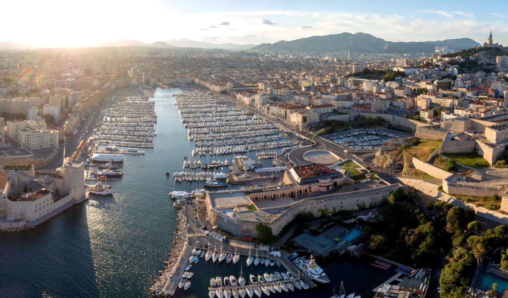 Aerial view of Marseille's Old Port and Fort Saint-Jean at sunset