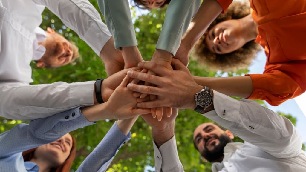 Group holding hands in a circle