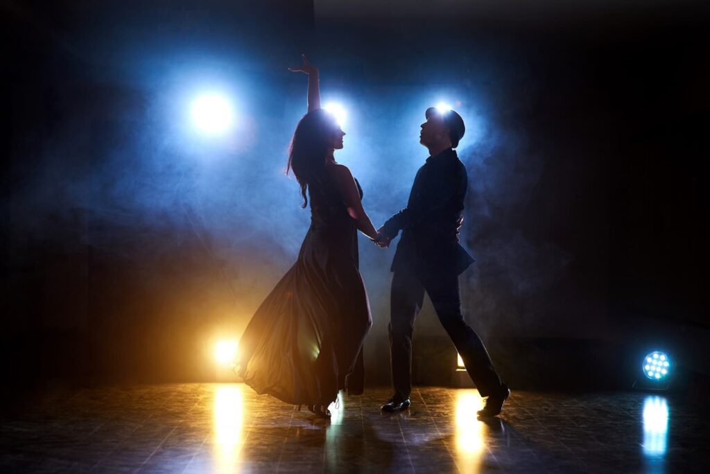Man and woman dancing on stage